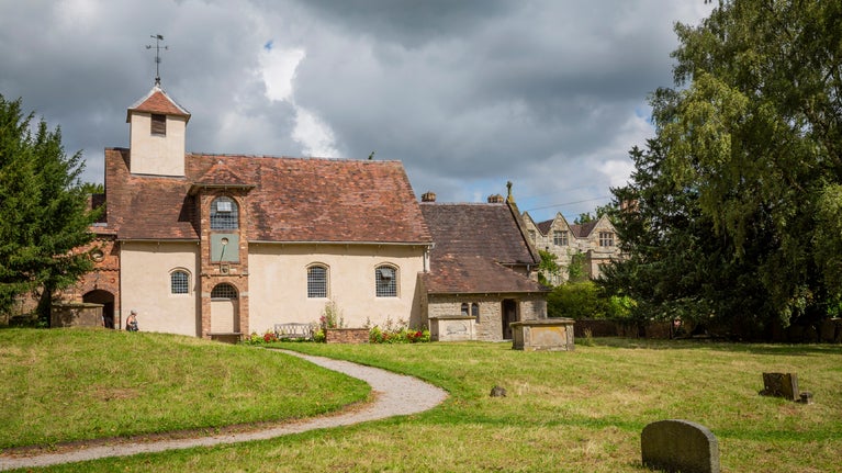 Church in a leafy churchyard